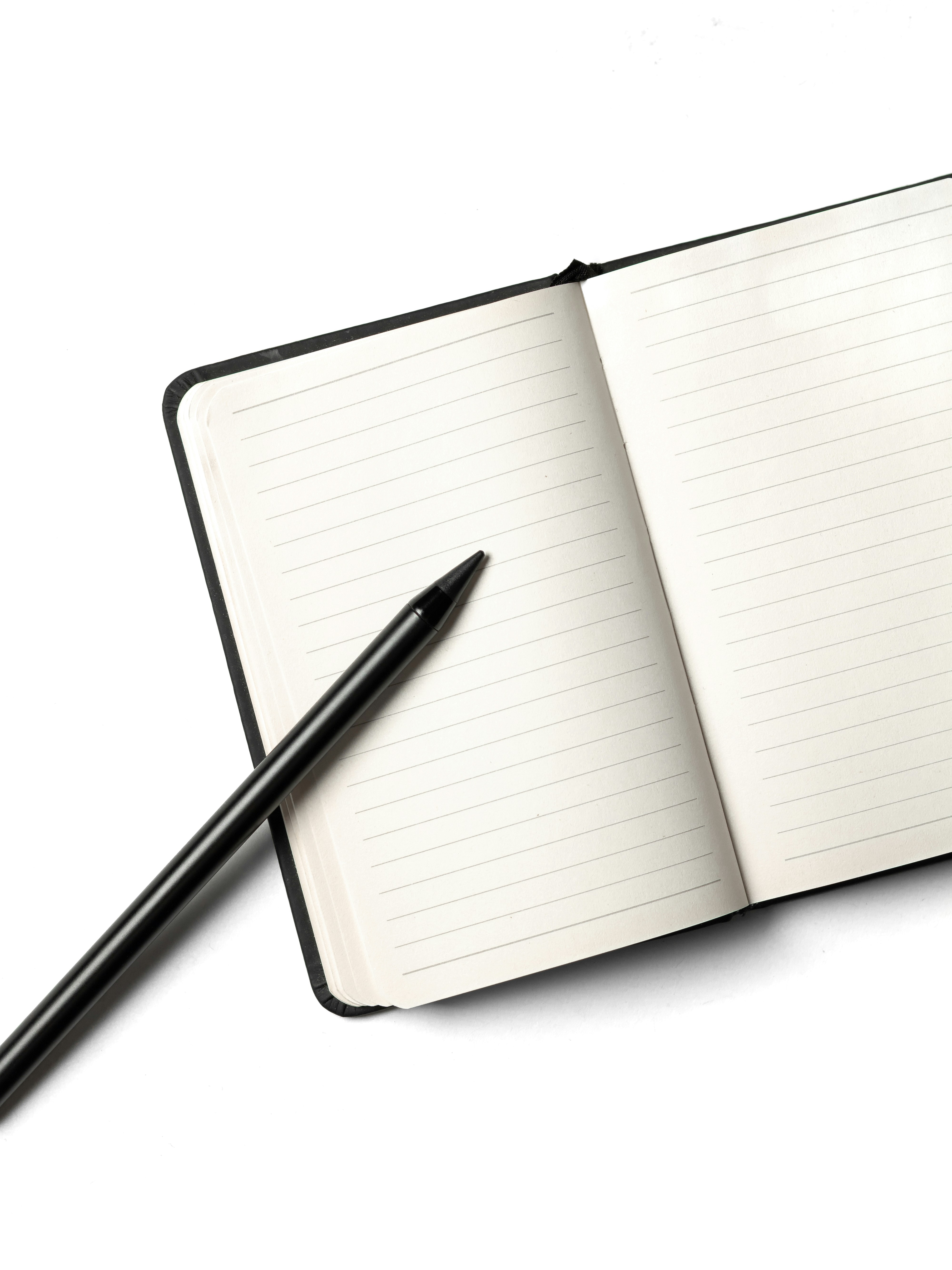 Open notebook with a pen — ready for your notes